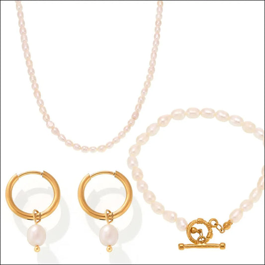 Elegant pearl jewelry set for women featuring necklace, earrings, and bracelet with gold accents