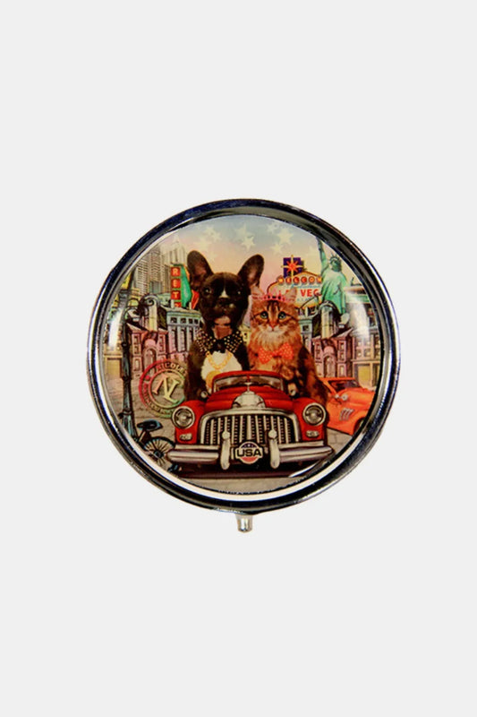 Unique animal print jewelry pin featuring a dog and cat in a vintage car against a city backdrop